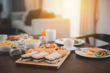 Fresh and bright continental breakfast healthy, Breakfast served food with beverage coffee, orange juice on table in the morning at home