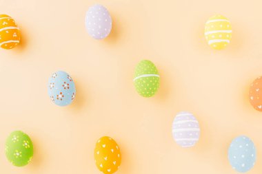 Colorful easter eggs isolated on pastel background with copy space, Funny decoration, Creative composition banner web design holiday background, Happy Easter Day greeting card, flat lay top view