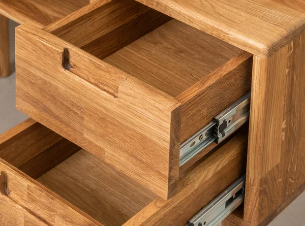 Opened drawers close view photo, wooden eco furniture elements background. Solid wood furniture details