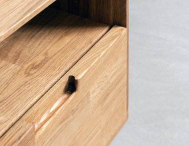 Drawers close view photo, wooden furniture elements background. Furniture details