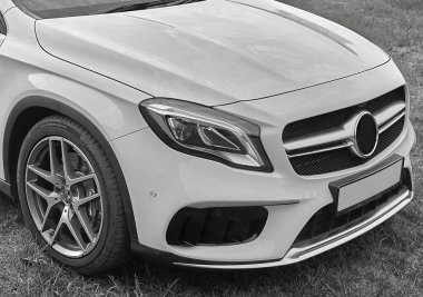 Modern car background,  city car standing in the field
