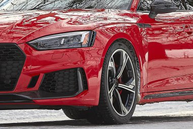 Modern red car in the winter forest background,  car wallpaper