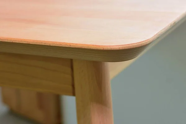 Wooden furniture surface. Natural wood close view photo background. Solid wood table top and legs. Eco furniture production, manufacturing concept