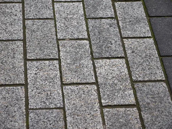 Brick road pattern close view, stone texture background