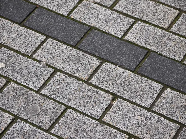 Brick road pattern close view, stone texture background