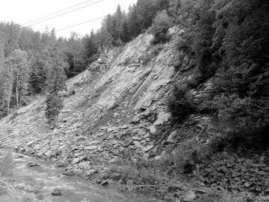 Rocks and mountain river flowing among them clipart