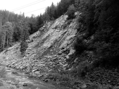 Rocks and mountain river flowing among them clipart