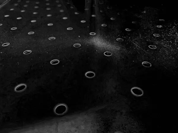 stock image Metal surface with holes abstract background