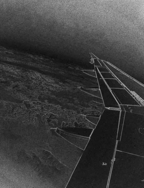 stock image Airplane flight in deep blue sky over white clouds. French airlines plane wing as it is seen from the illuminator