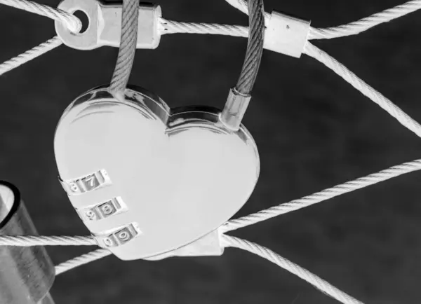 stock image Heart lock at the bridge, red heart lock with a code, love and passion photo. A password from my heart concept