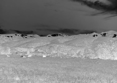 Tranquil Highland Landscape Under a Cumulus-Laden Sky clipart