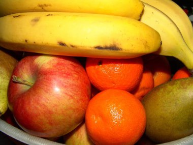 Fruit on a plate close view, apples, bananas clipart