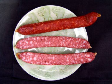 Sausage on a plate close view background clipart