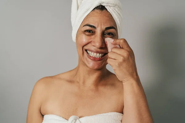 Happy Latin Woman Massaging Facial Skin Jade Gua Sha People — Stok Foto