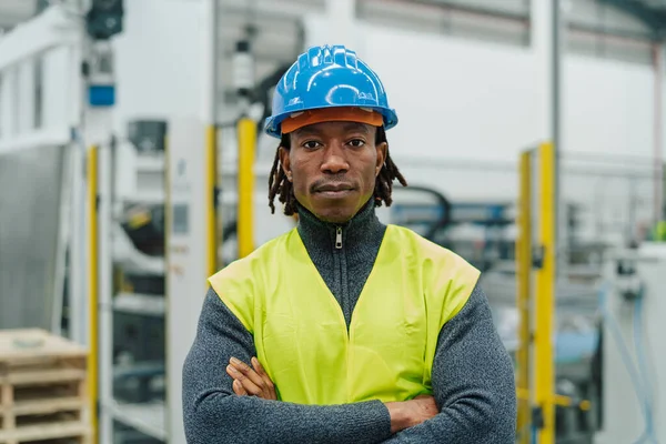 African engineer man working inside automation factory - Industry concept