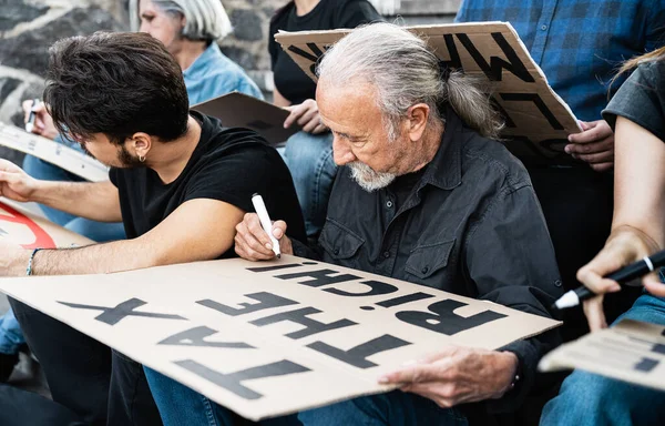 Diverse Activists Different Age Ethnicity Preparing Protest Banners Financial Crisis — Stock Photo, Image