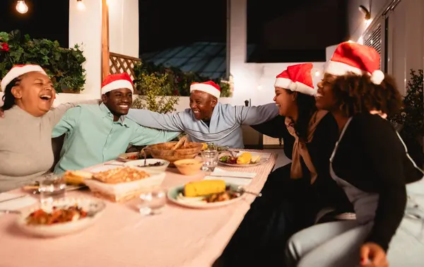 Happy African Family Celebrate Christmas Holidays Having Dinner Together Home Stock Photo