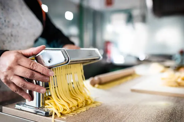 Close Female Hands Preparing Fresh Pasta Using Traditional Machine Cuisine Stock Picture