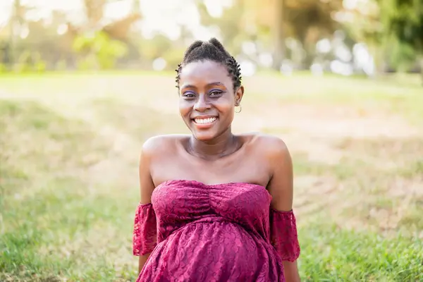 Happy African Pregnant Woman Smiling Camera Public Park Maternity Lifestyle Stock Photo