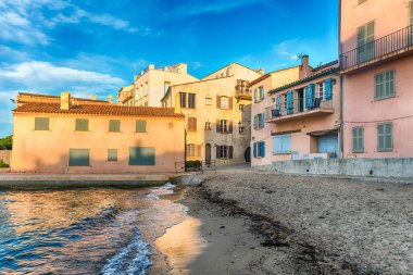 The scenic La Ponche beach in central Saint-Tropez, Cote d'Azur, France. The town is a worldwide famous resort for the European and American jet set and tourists clipart