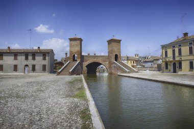 View over the Trepponti Bridge, a masonry arch bridge and iconic landmark in Comacchio, Italy clipart