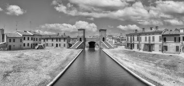 View over the Trepponti Bridge, a masonry arch bridge and iconic landmark in Comacchio, Italy clipart