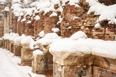 Burdur Sagalassos Archeological Site.To visit the sprawling ruins of Sagalassos, high amid the jagged peaks of Ak Dag, is to approach myth: the ancient ruined city set in stark . Sagalassos Ancient City under the snow on a winter day. clipart