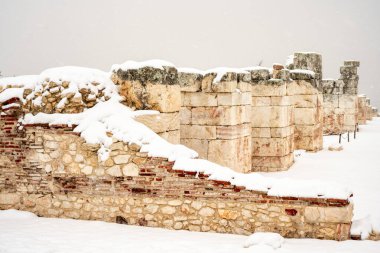 Burdur Sagalassos Archeological Site.To visit the sprawling ruins of Sagalassos, high amid the jagged peaks of Ak Dag, is to approach myth: the ancient ruined city set in stark . Sagalassos Ancient City under the snow on a winter day. clipart