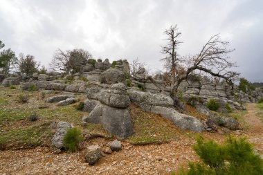 Majestic view of valley with beautiful rock formations on a autumn day. Adamkayalar, Selge, Manavgat, Antalya, Turkey. clipart