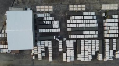 Lots of boxes in the warehouse outdoor. Goods zone are ready for trade with the merchandise.