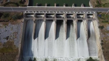 An aerial view over the Pasak Jolasid dam, Lopburi Province, Thailand. Tracking the movement of the floodgates that are releasing water into rural canals in enormous amounts of water.