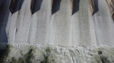 An aerial view over the Pasak Jolasid dam, Lopburi Province, Thailand. Tracking the movement of the floodgates that are releasing water into rural canals in enormous amounts of water.