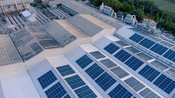 stock image Aerial view of solar roof of the factory in eco environment. Solar Cells panel reflection with the sun and turn to blue color in industrial area. Concept of energy recycle.