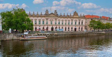 Berlin, Germany - July 6, 2011 : Spree River and Deutsches Historisches Museum ( German Historical Museum ) with River transport to the destination.