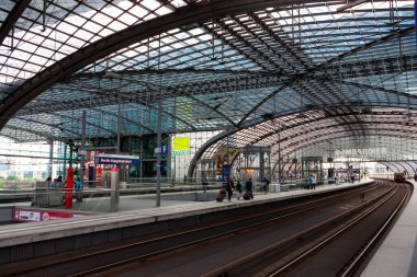 Berlin, Germany - July 6, 2011 : Platforms of Berlin Hauptbahnhof train station under a glass dome.
