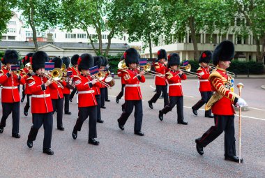 London, United Kingdom - June 30, 2010 : Band of the Queen's Guards marching towards Buckingham Palace.  clipart