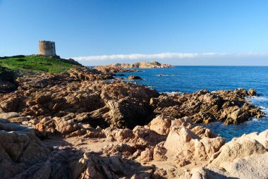 The coast of Isola Rossa and the Aragonese tower