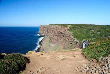 The coast of Capo Nieddu near same waterfall