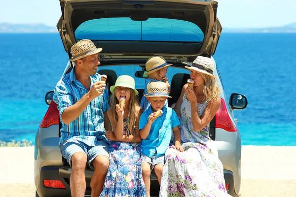 family near the sea by car with ice cream concept happy together