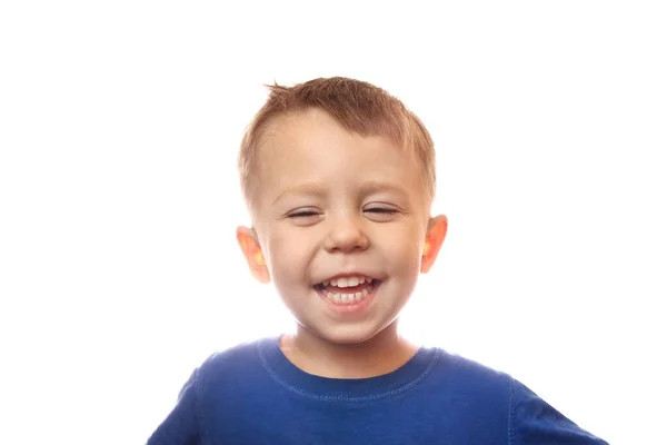 Emotions of a happy child on a white background in the studio
