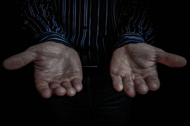 Hands of a begging poor man on the street bum