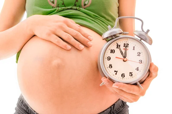 Hermosa Joven Embarazada Sobre Fondo Blanco Con Despertador — Foto de Stock