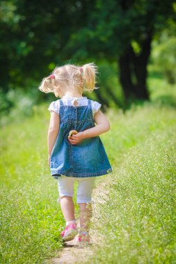 happy child playing a fun and draws on the nature of the park