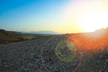Beautiful desert landscape at sunset mountains background