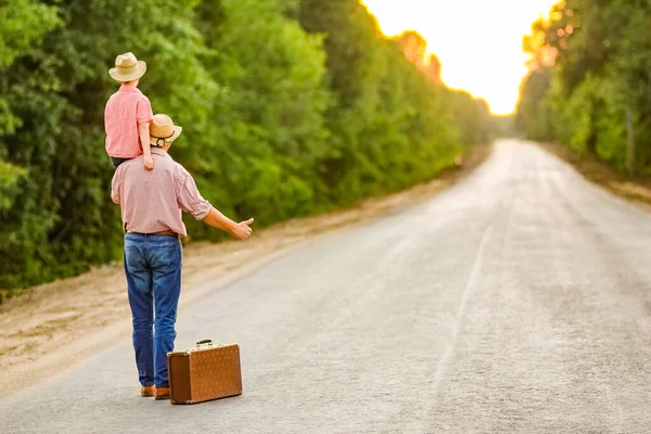 Father Son Walk Road Holding Hands Suitcase — Stock Photo, Image