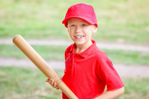 stock image Happy child with baseball bat on nature concept in park