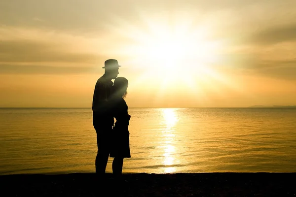 happy couple by the sea on nature in travel silhouette