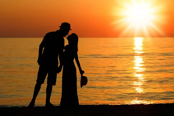 happy couple by the sea in nature silhouette weekend travel