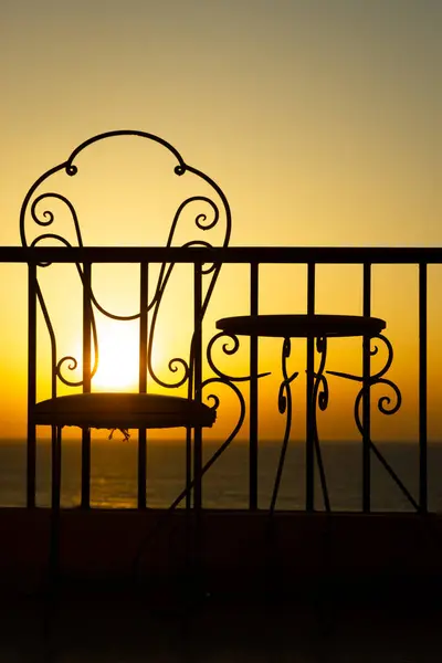 Very Beautiful Silhouette Chairs Seashore Sea Stock Picture
