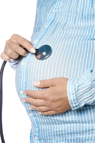 stock image Happy pregnant girl lies on white background